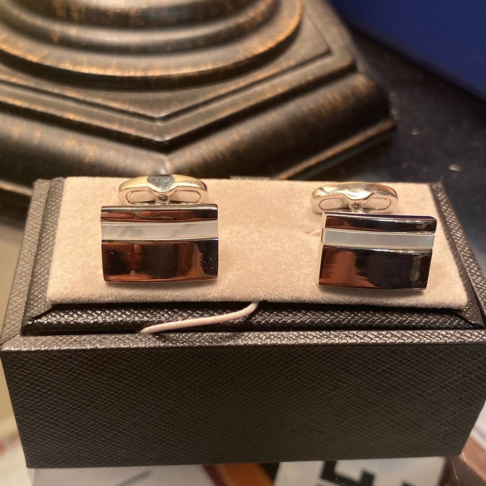 Silver and white cufflinks